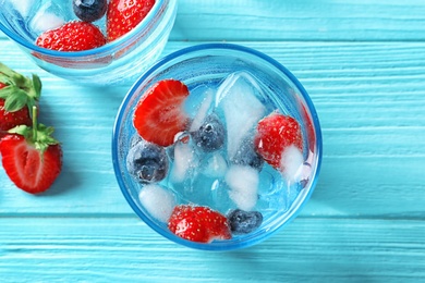 Photo of Flat lay composition with natural lemonade on wooden background