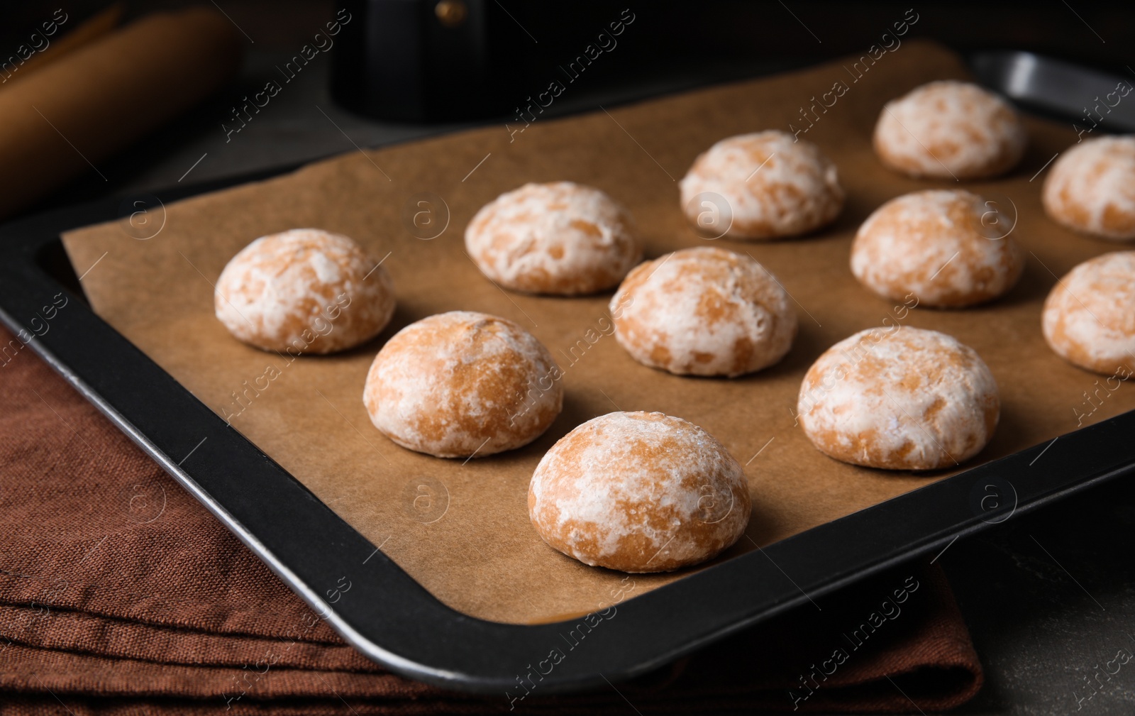 Photo of Tasty homemade gingerbread cookies on baking tray, closeup