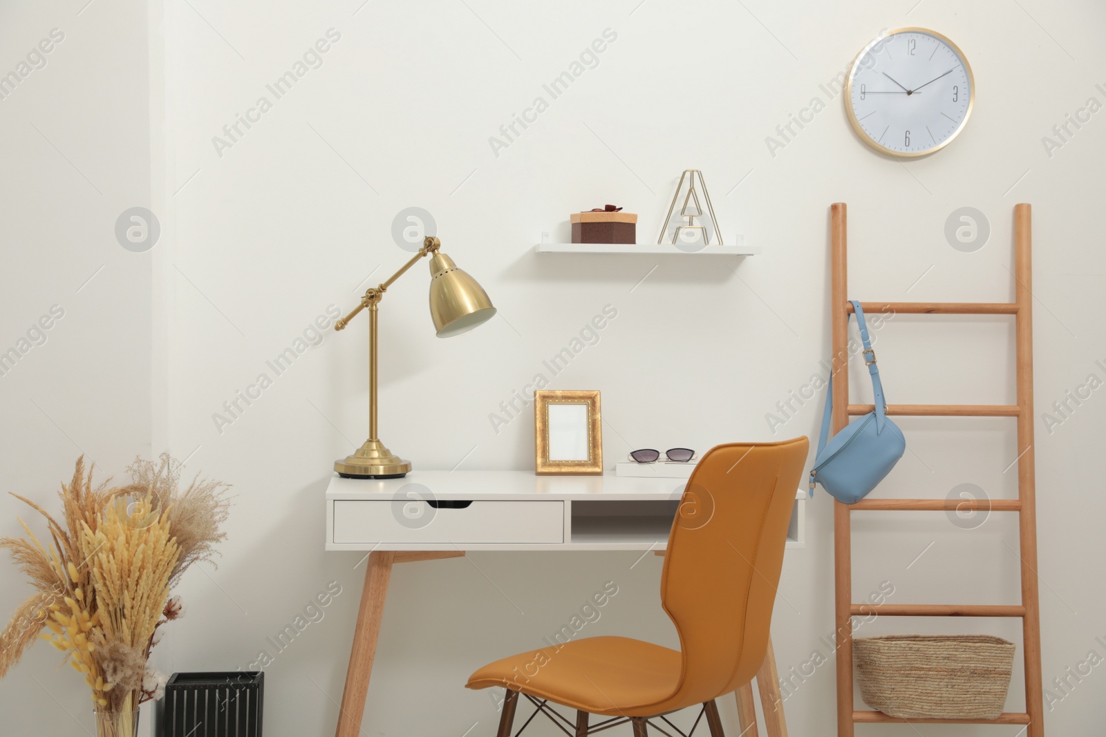 Photo of Comfortable workplace near light wall. Interior design
