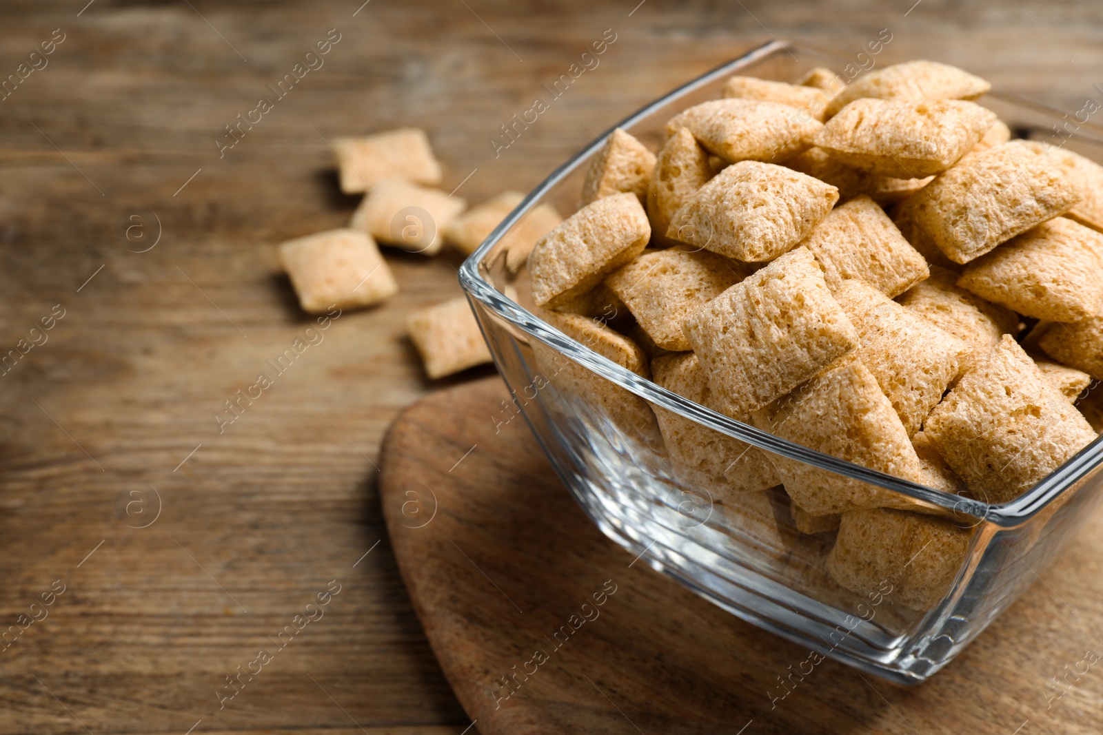 Photo of Delicious corn pads on wooden table, closeup. Space for text