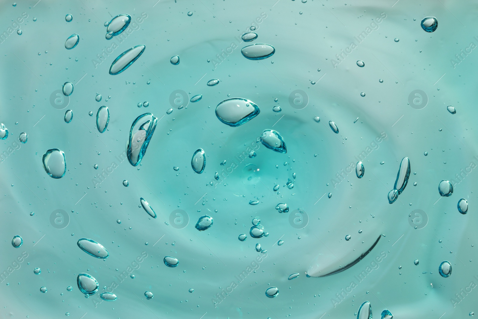 Photo of Turquoise facial gel as background, closeup view