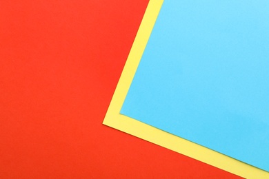 Colorful paper sheets as background, top view