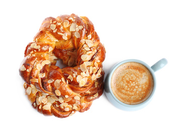 Delicious pastries and coffee on white background, top view