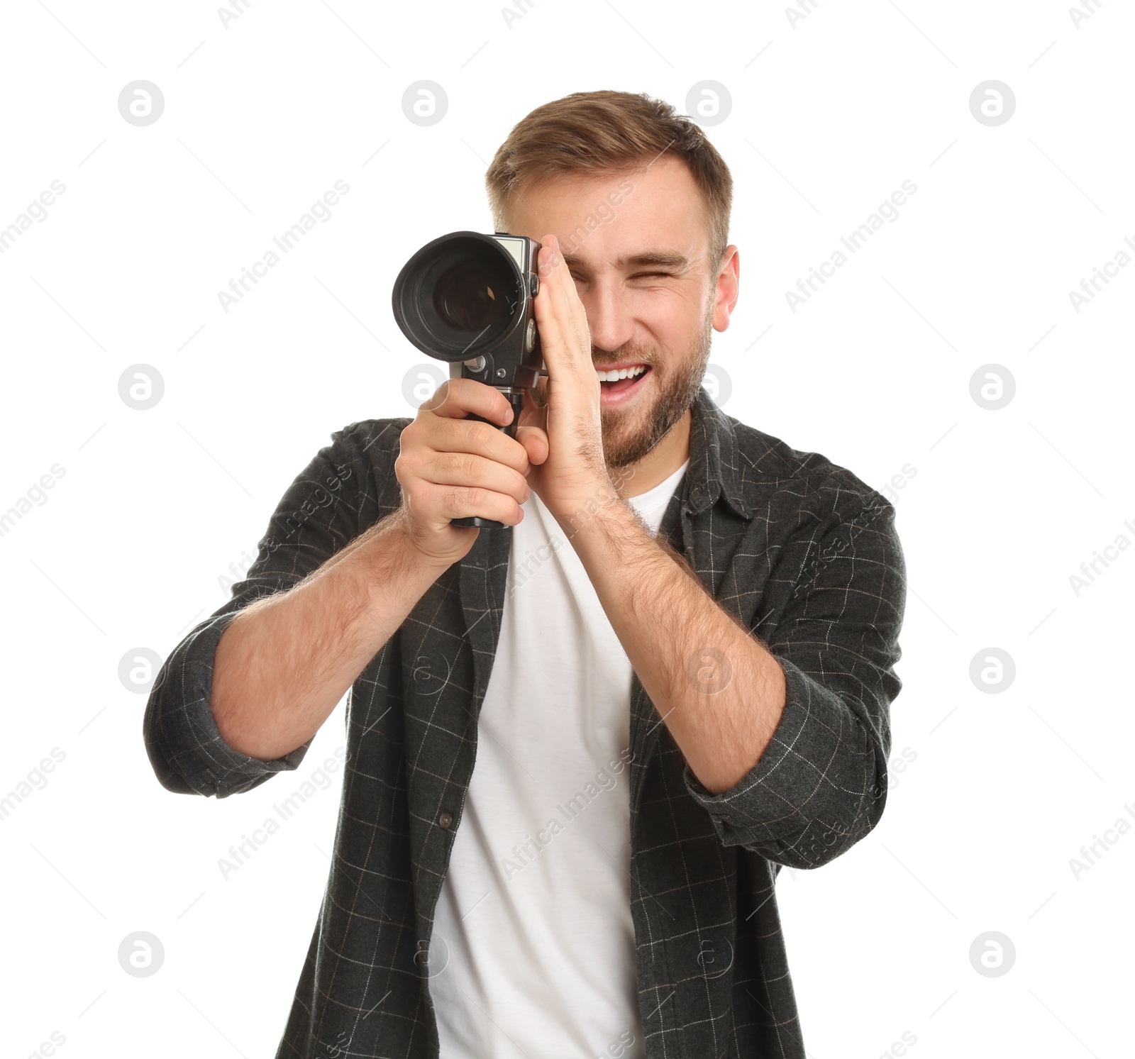 Photo of Young man using vintage video camera on white background