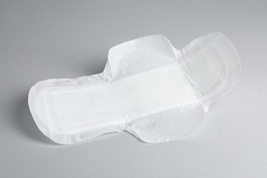 Photo of Sanitary napkin on light grey background. Gynecology concept