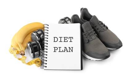 Photo of Notebook with phrase Diet Plan, fitness items and bananas on white background. Weight loss program