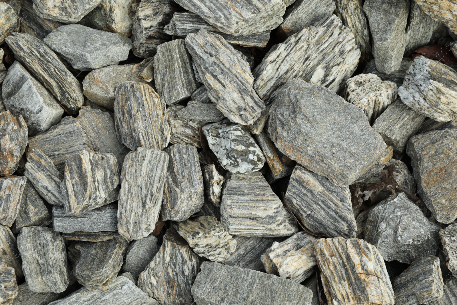 Photo of Grey decorative stones as background, top view