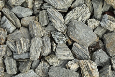 Photo of Grey decorative stones as background, top view