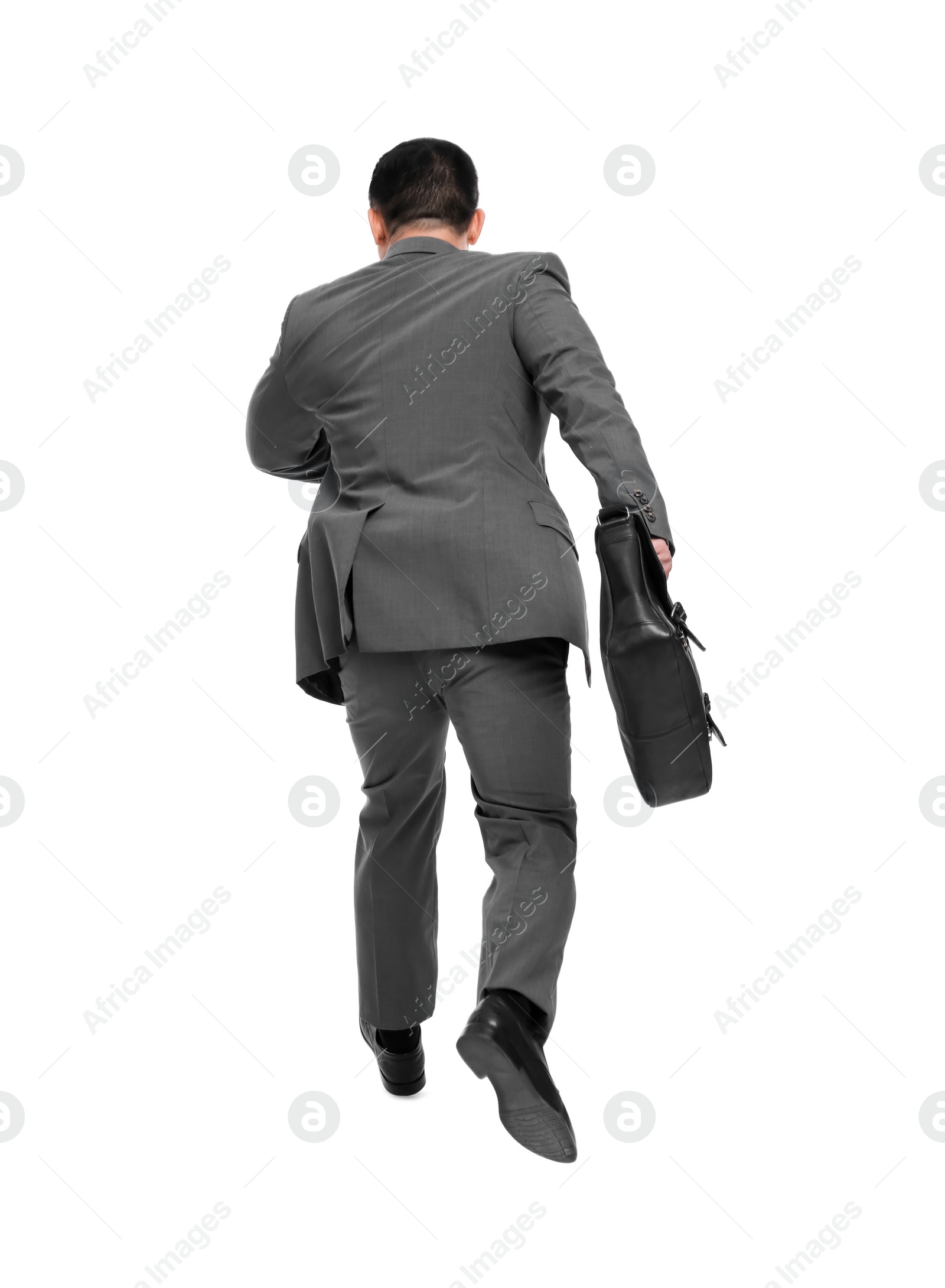 Photo of Businessman with briefcase running on white background, back view