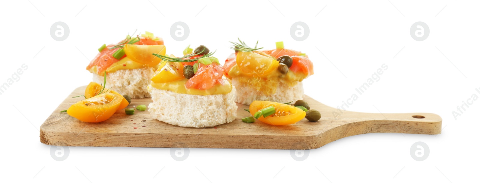 Photo of Tasty canapes with salmon, tomatoes, capers and herbs isolated on white