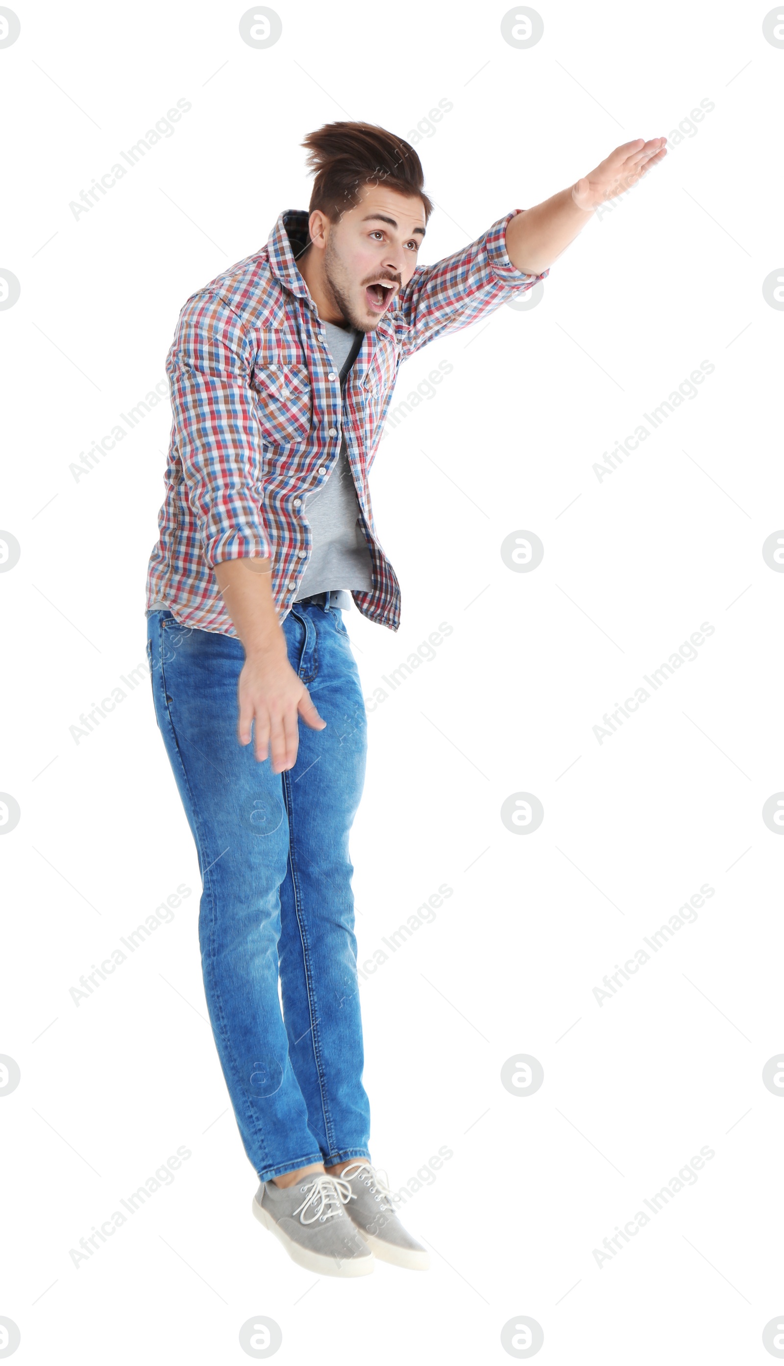 Photo of Young man attracted to magnet on white background