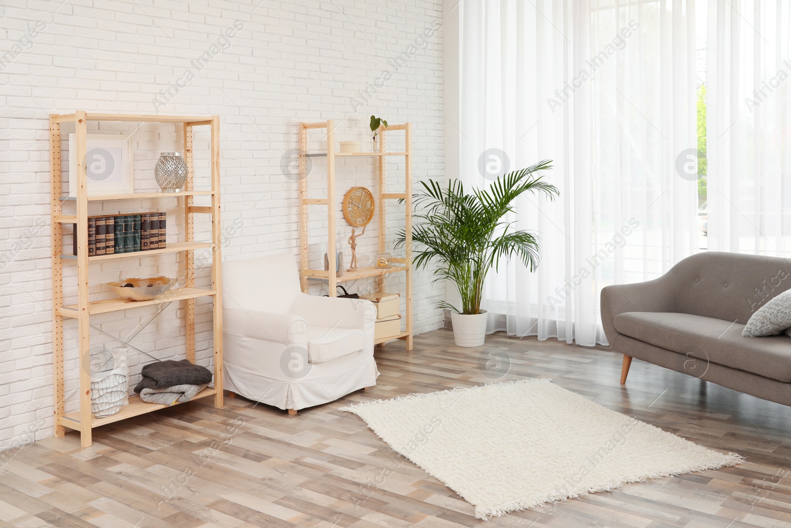 Photo of Wooden storage in stylish living room. Idea for interior design