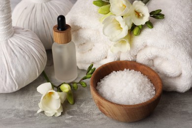 Photo of Beautiful composition with different spa products on light gray table, closeup