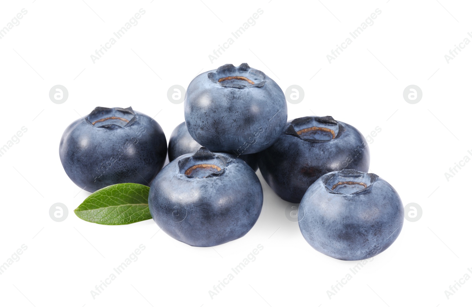 Photo of Pile of fresh ripe blueberries and leaves isolated on white