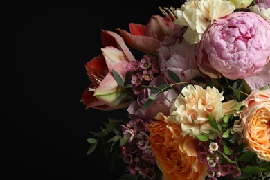 Photo of Beautiful bouquet of fresh flowers on dark background