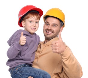 Photo of Father and son in hard hats showing thumbs up on white background. Repair work