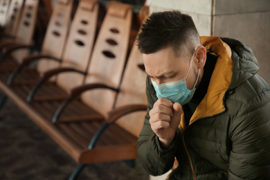 Photo of Man with disposable mask indoors. Virus protection