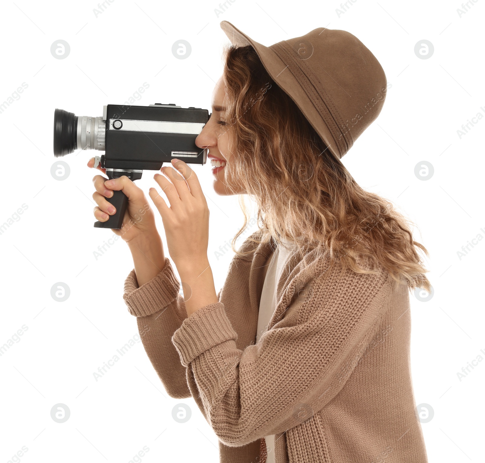 Photo of Beautiful young woman using vintage video camera on white background
