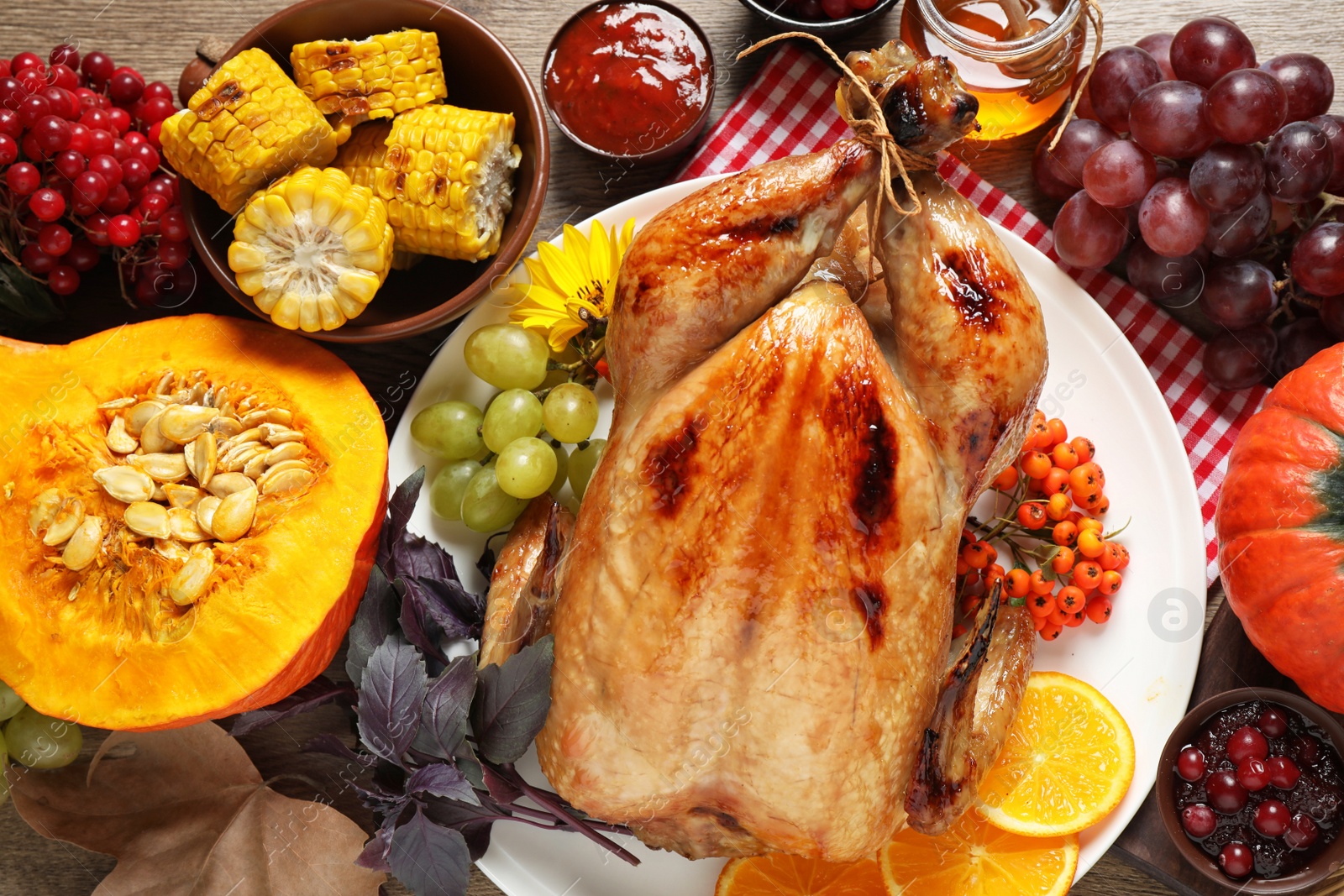 Photo of Flat lay composition with turkey on wooden background. Happy Thanksgiving day