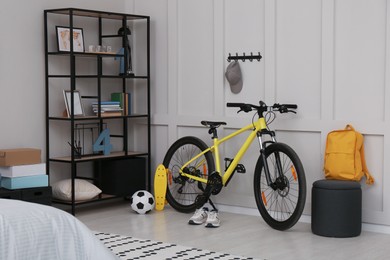 Photo of Sports equipment in stylish teenager's room interior