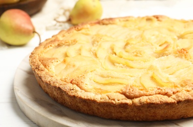 Delicious sweet pear tart on table, closeup