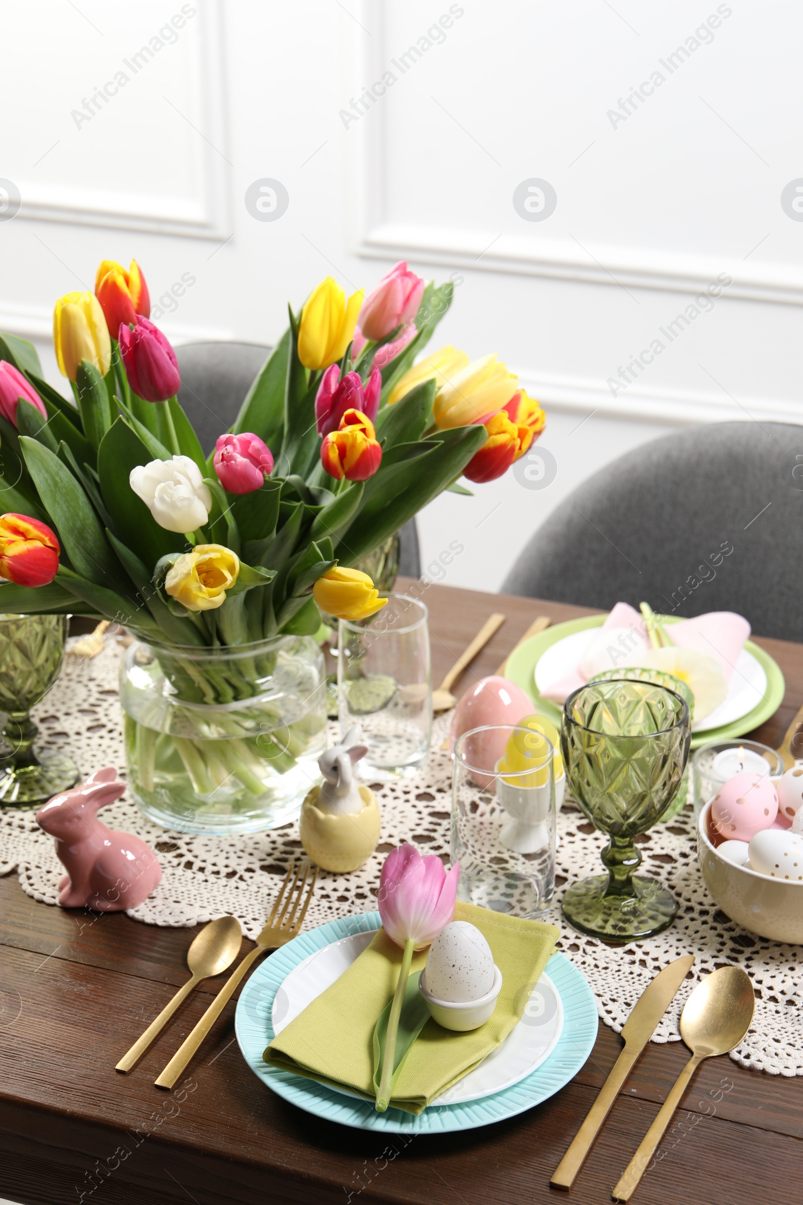 Photo of Festive table setting with beautiful flowers. Easter celebration