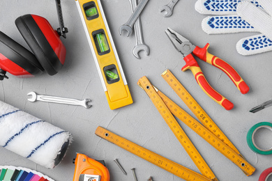 Photo of Flat lay composition with construction tools on light grey background