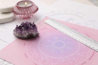 Photo of Zodiac wheel for fate forecast at table, closeup. Astrological predictions