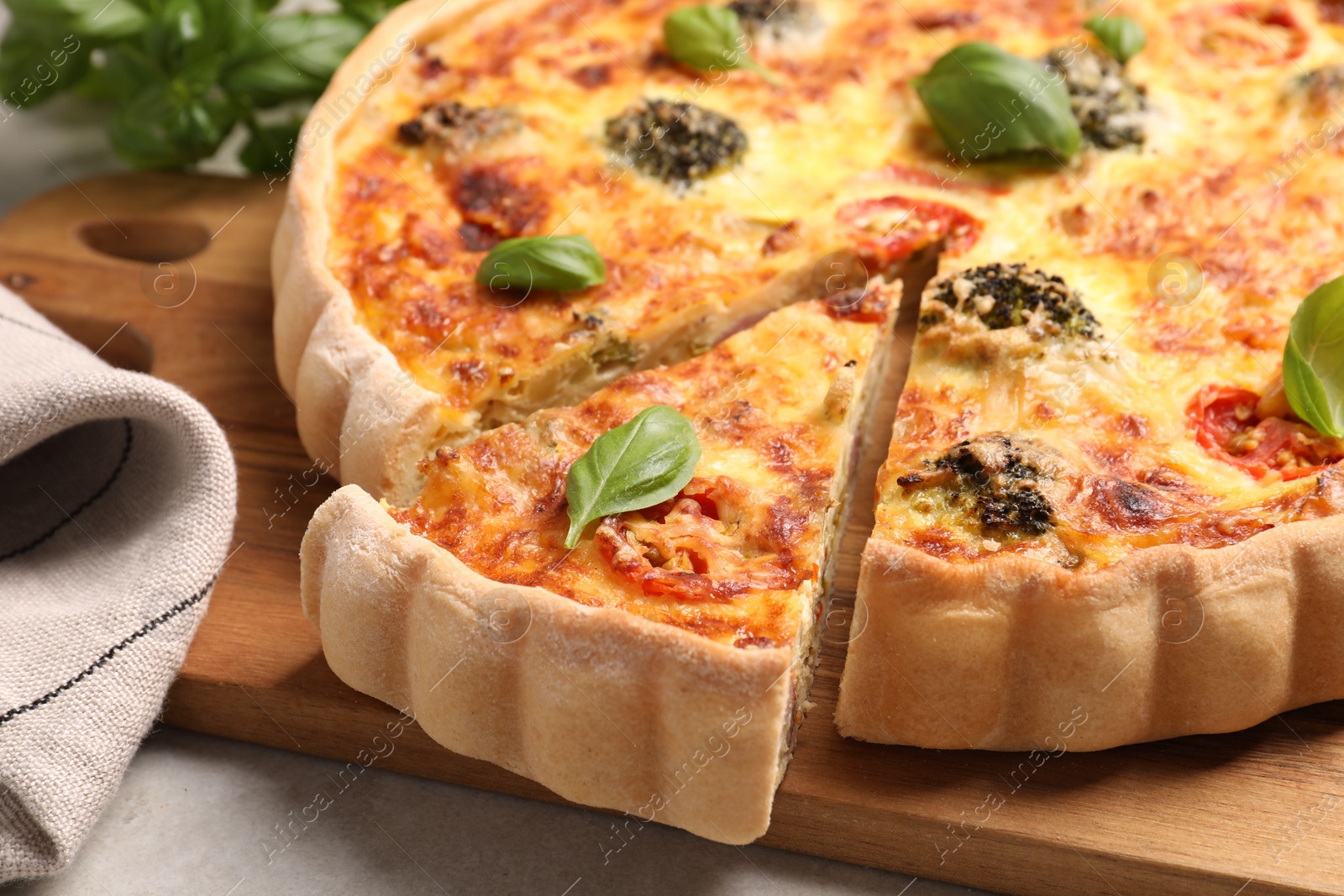 Photo of Delicious homemade vegetable quiche on table, closeup