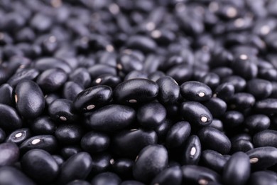 Photo of Many raw black beans as background, closeup