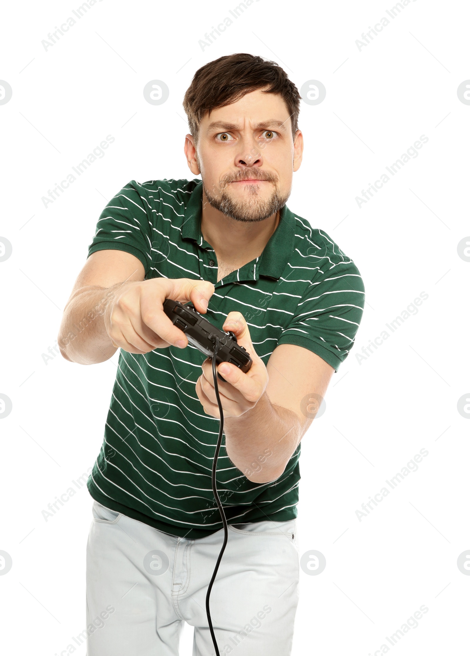 Photo of Emotional man playing video games with controller isolated on white