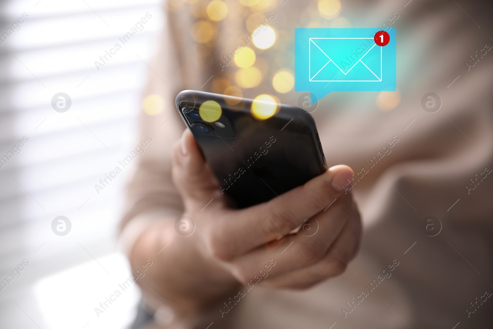 Image of Email. Man using mobile phone indoors, closeup. Letter illustration over device