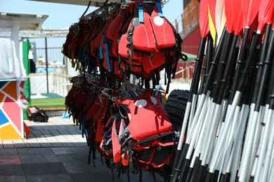 Photo of Holder with life jackets and paddle storage rack on beach