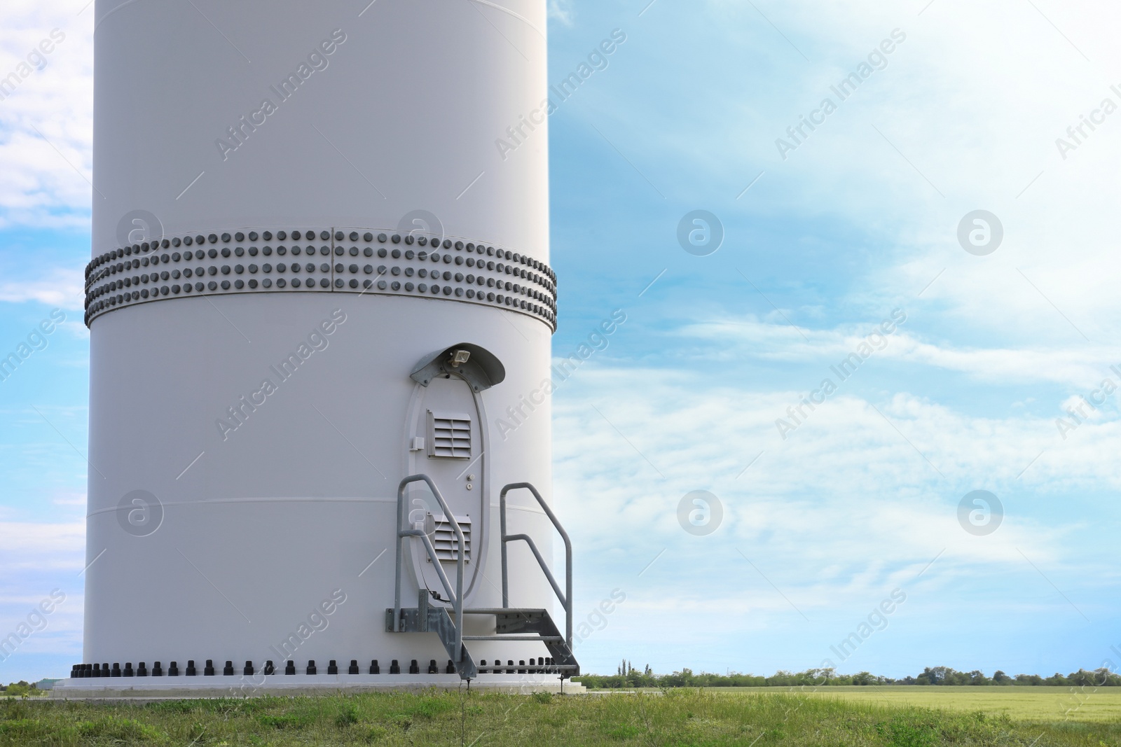 Photo of Entrance to wind turbine power generator outdoors. Alternative energy source