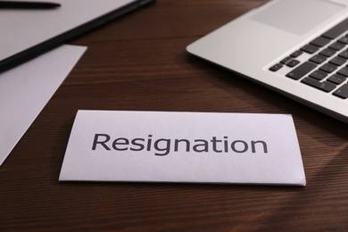 Photo of Resignation letter on wooden table in office