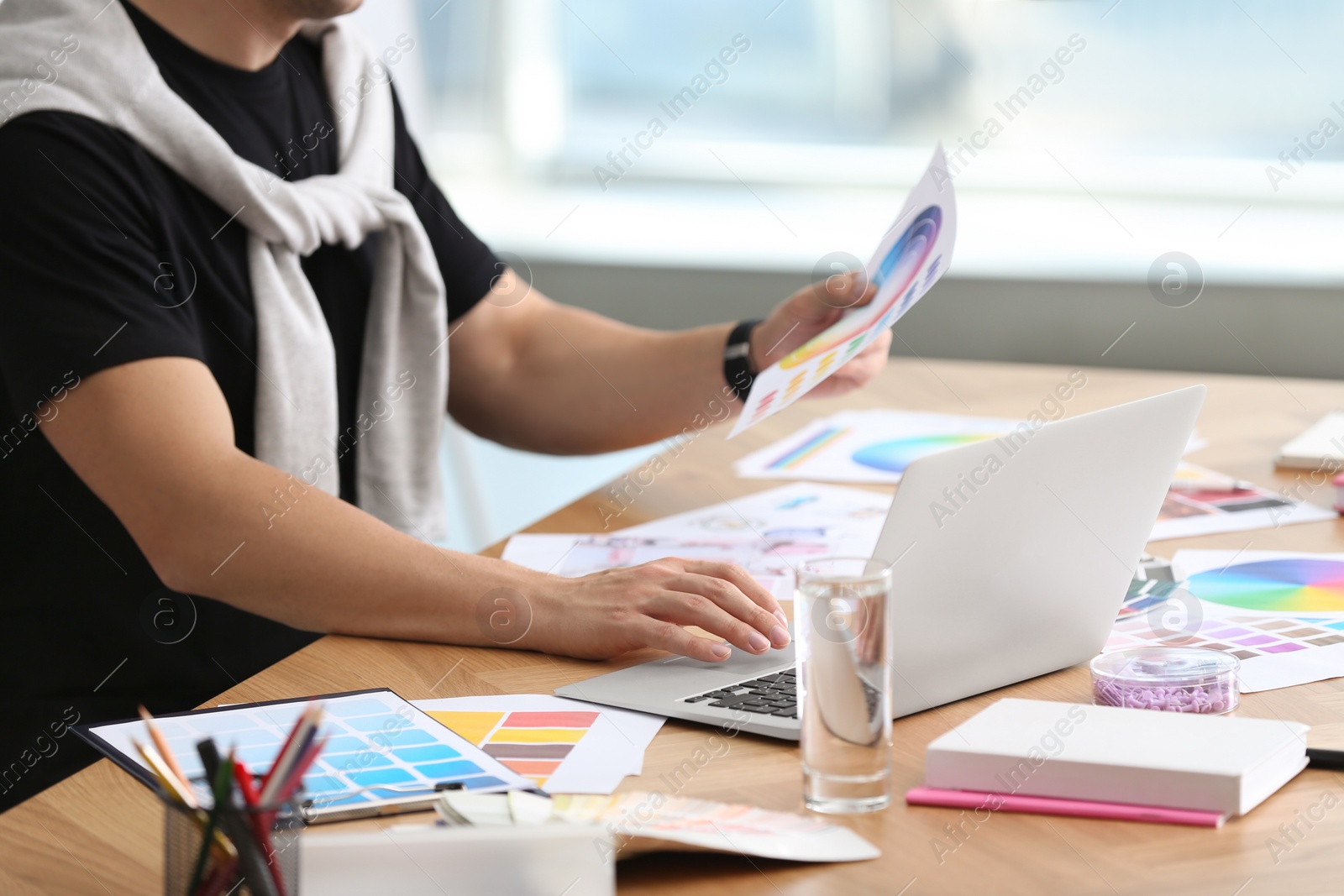 Photo of Professional interior designer at workplace in office, closeup