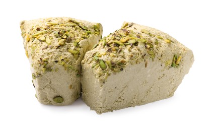 Photo of Pieces of tasty halva with pistachios on white background