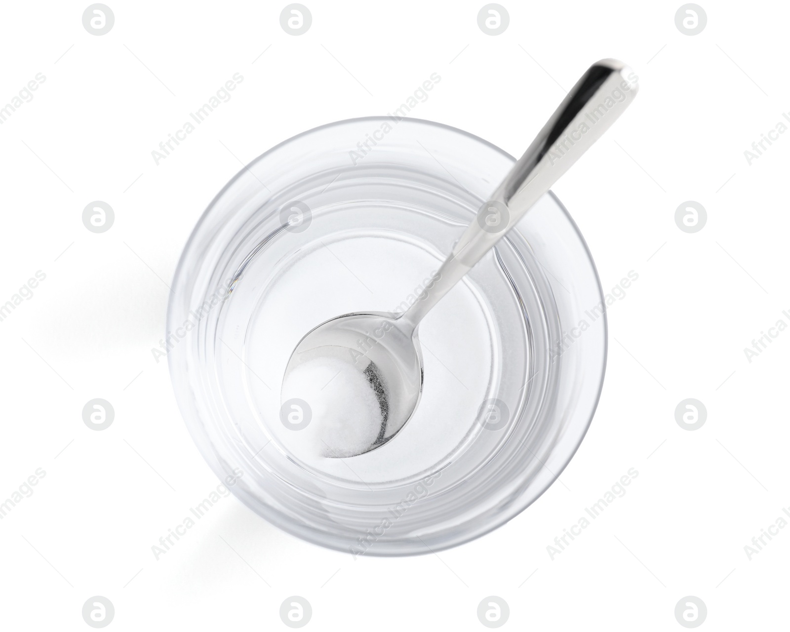 Photo of Glass of water with baking soda on white background, top view