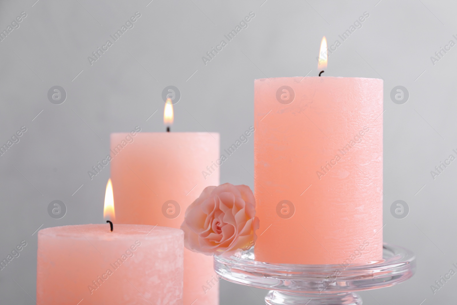 Photo of Beautiful composition with candles on grey background