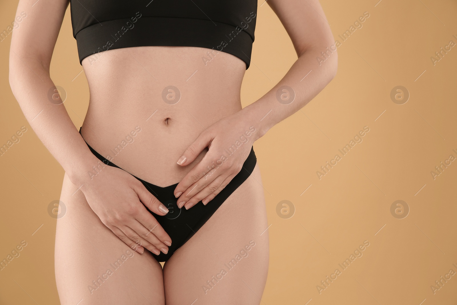 Photo of Gynecology. Woman in underwear on yellow background, closeup. Space for text