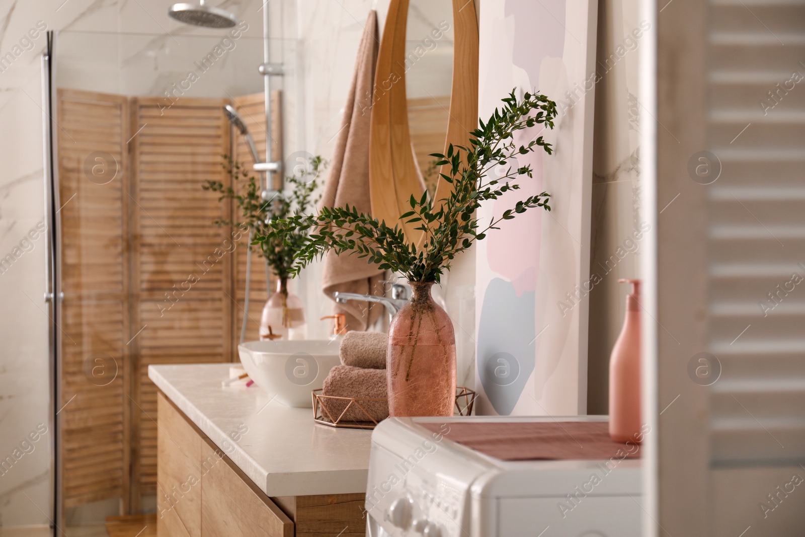 Photo of Modern bathroom interior with stylish mirror and vessel sink