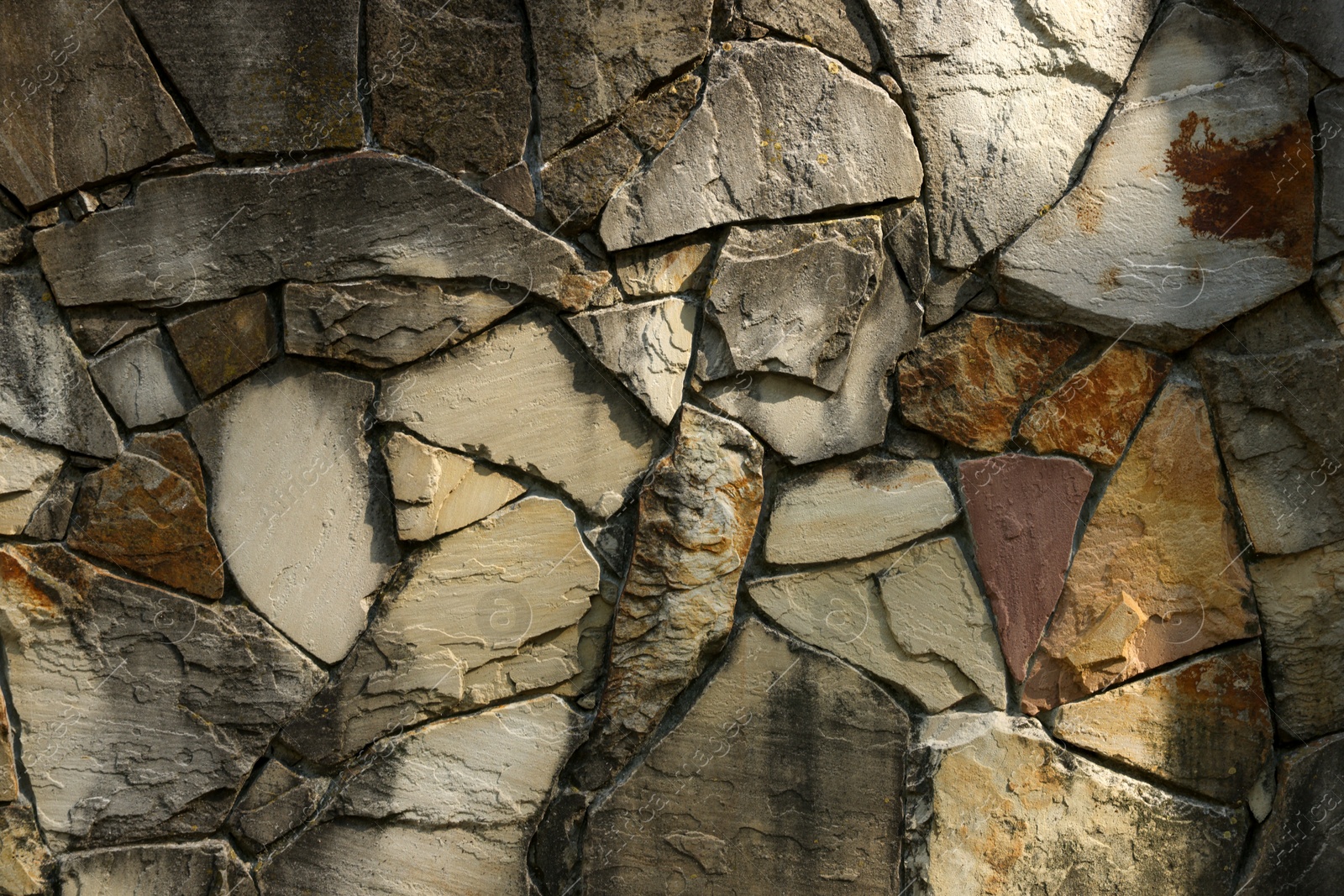 Photo of Texture of dark stone wall as background