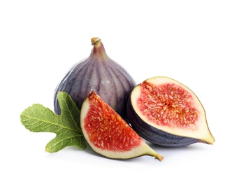 Whole and cut purple figs on white background