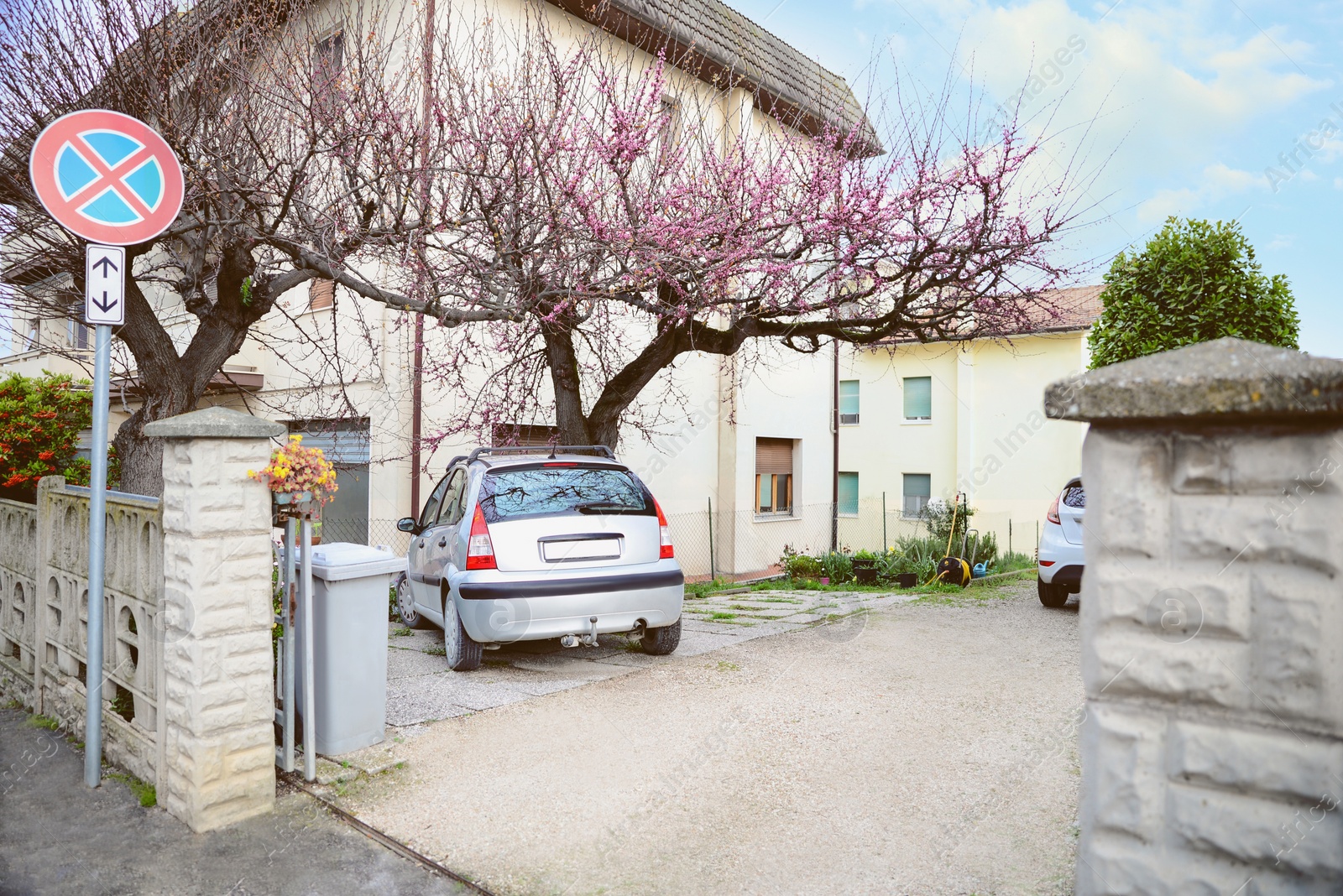 Photo of Cars parked near apartment building in yard