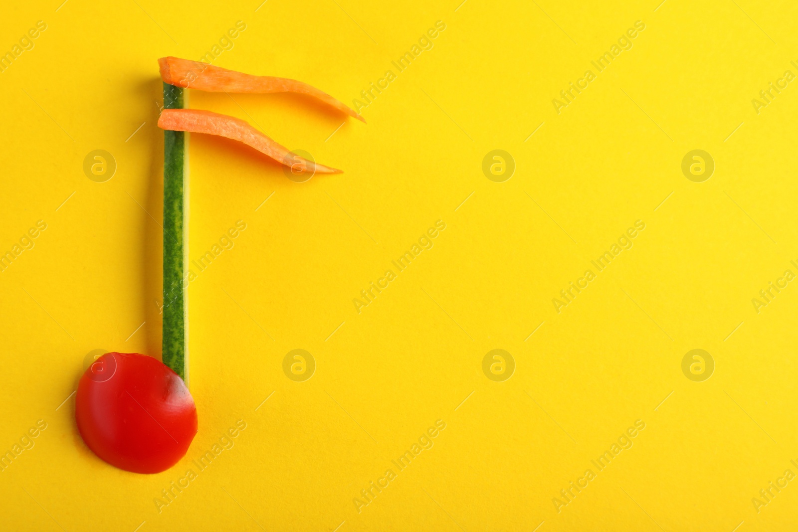 Photo of Musical note made of vegetables on color background, top view. Space for text