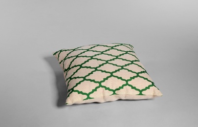 Single stylish decorative pillow on light background