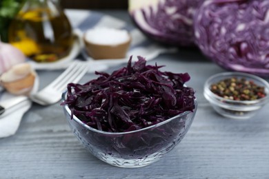 Photo of Tasty red cabbage sauerkraut on light grey wooden table