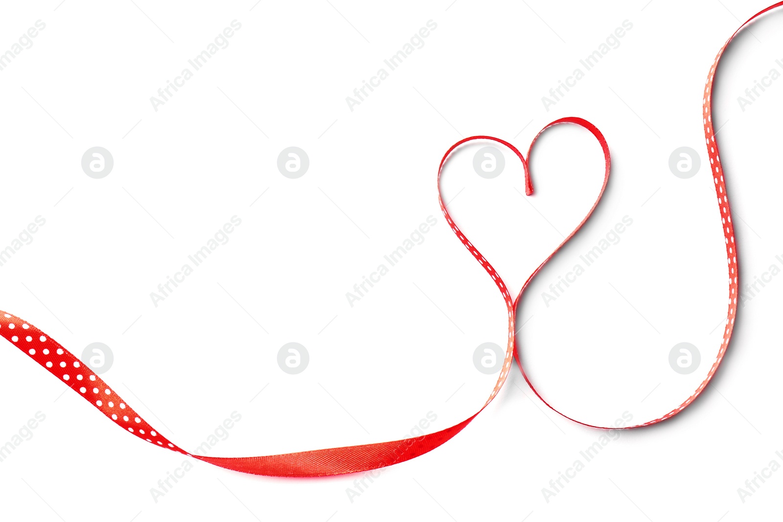 Photo of Heart made of satin ribbon on white background, top view