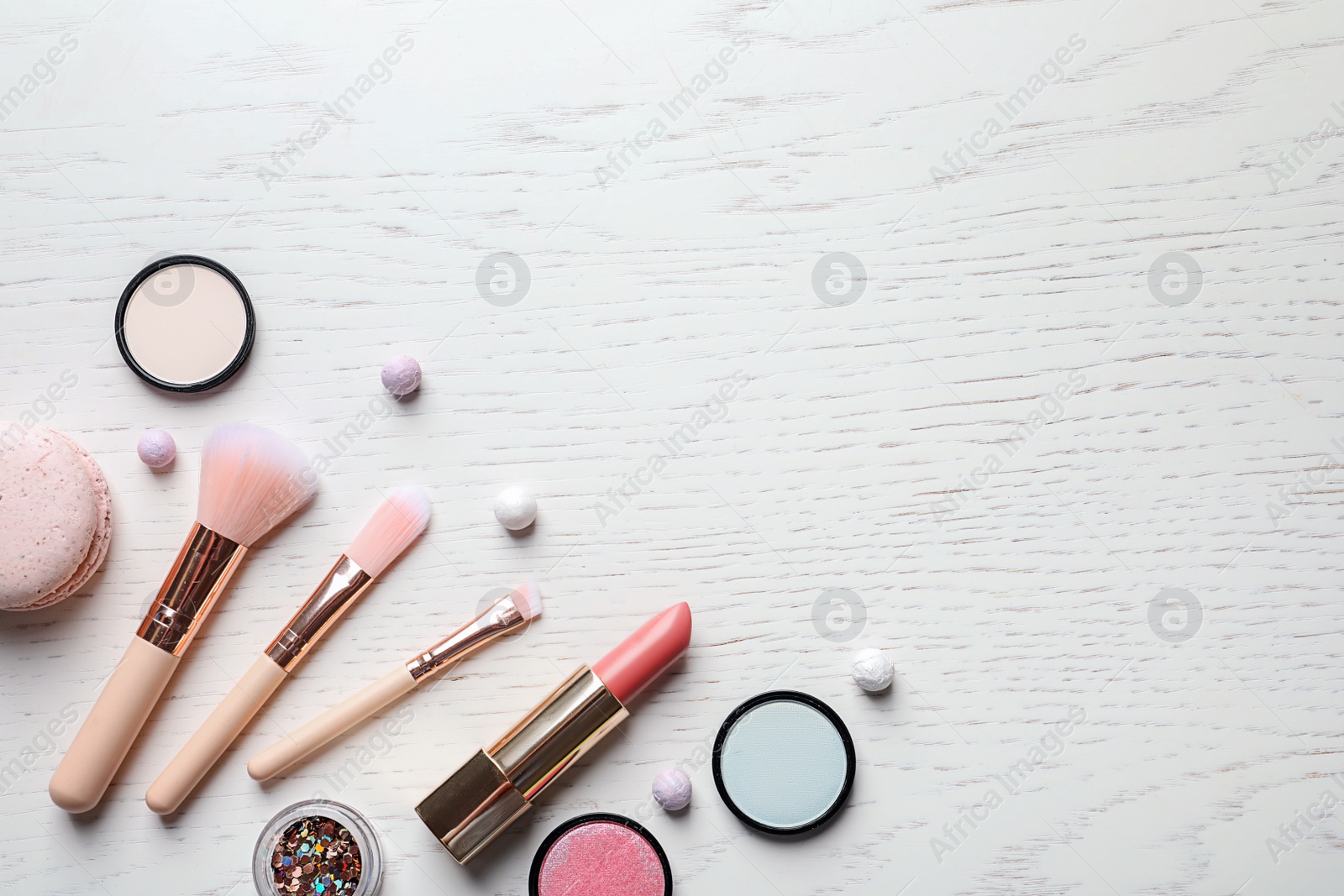 Photo of Flat lay composition with decorative cosmetics on light background