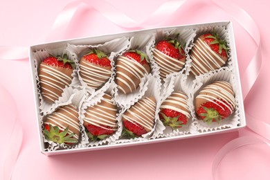 Photo of Box with delicious chocolate covered strawberries on pink background, top view